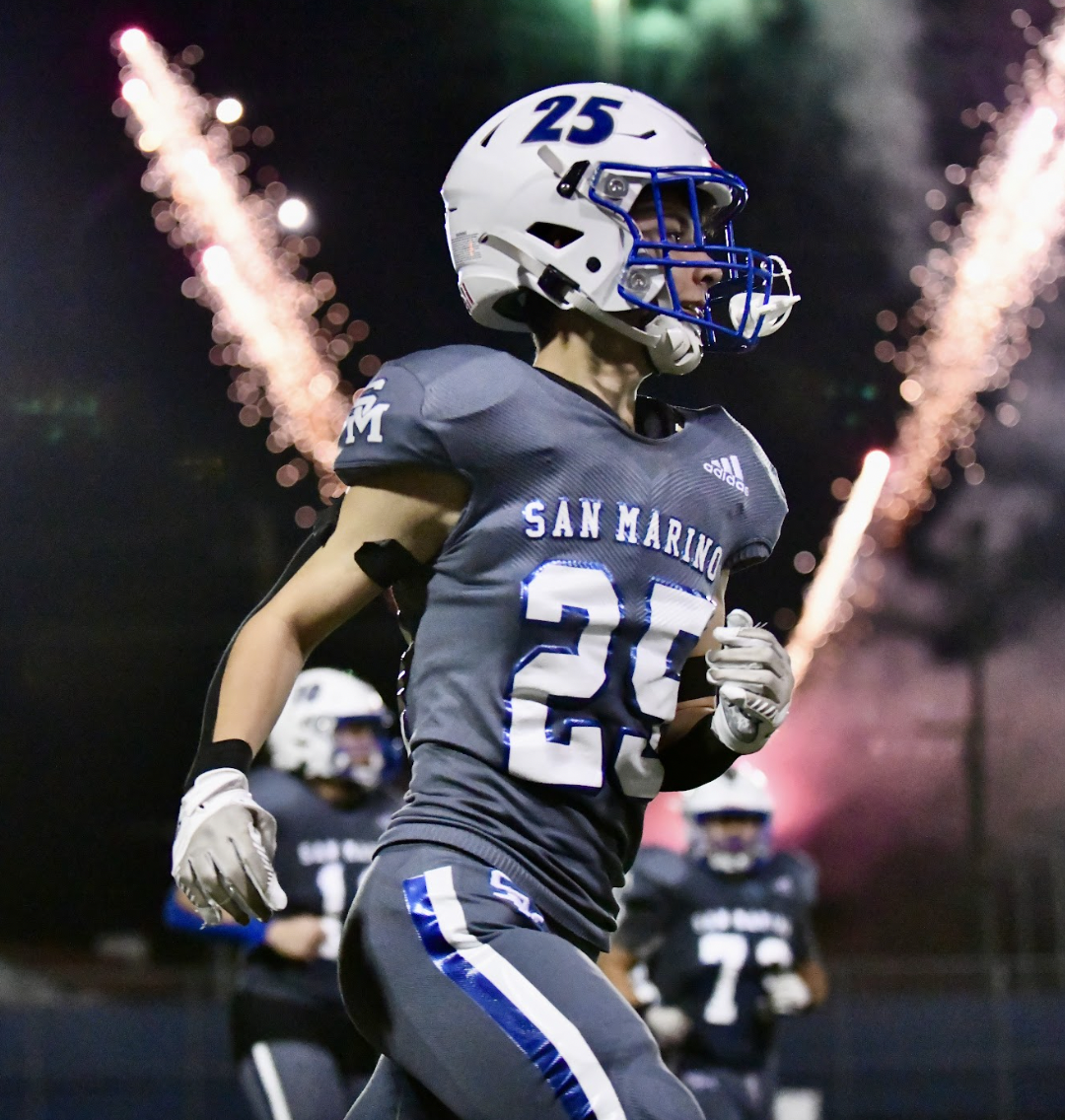 Jeffries runs onto the field after halftime during the Homecoming game