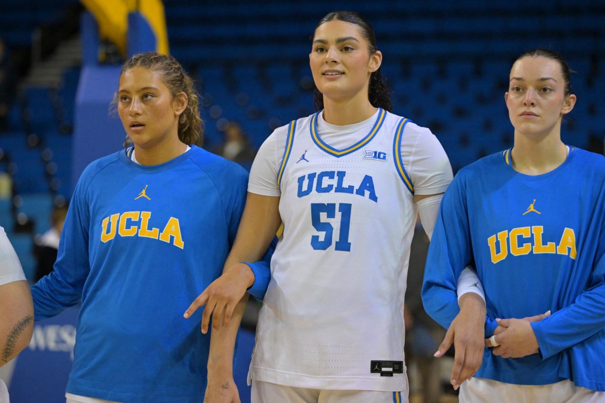 Dec 16, 2025; Los Angeles, California, USA;  UCLA Bruins forward Sienna Betts (16), left, and her sister center Lauren Betts (51) before the game against the Cal Poly Mustangs at Pauley Pavilion presented by Wescom Financial. Mandatory Credit: Jayne Kamin-Oncea-Imagn Images